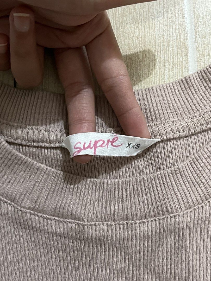 Supré Ribbed Mini Dress Brown XXS (Category: Dresses) located in Quezon City. Submitted by juliacassandr4a (Listing ID 1468829033, Image 2). Description: Supré Dress - Dusty Pink ribbed mini/bodycon dress - Size XXS on tag (fits XS-S), stretchy fabric - Worn a few times only, good condition, no issues .
