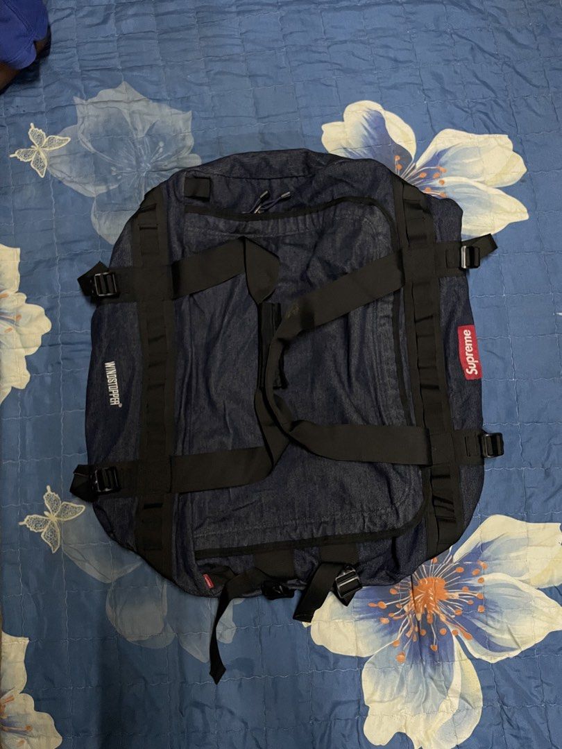 Supreme x The North Face Denim Backpack Windstopper (Category: Backpacks) located in Manila. Submitted by chawmichael (Listing ID 1468879132, Image 2). Description: - Authentic Supreme x The North Face collaboration backpack - Eye-catching blue denim material with Windstopper technology - Bold white logo branding on the front and straps - Iconic red Supreme box logo label stitched on the side - Equipped with multiple straps, handles, and spacious