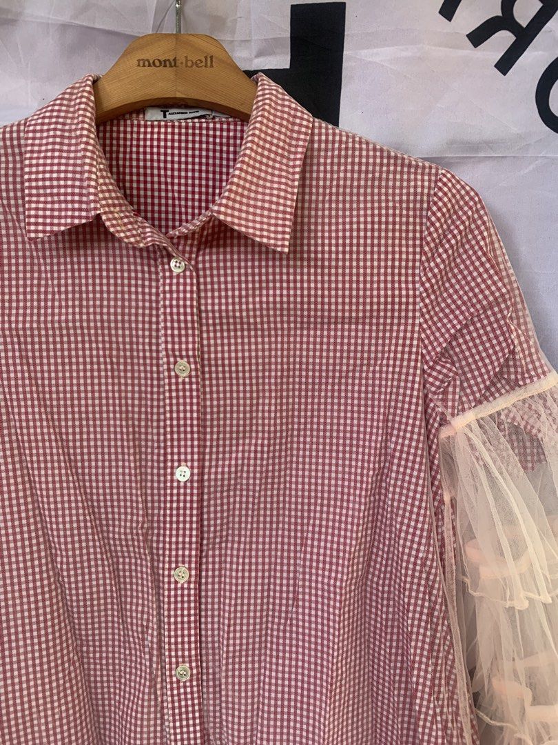 T by Alexander Wang Red/Pink Gingham Tulle Ruffle Polo Button Down (Category: Blouses) located in Angeles City. Submitted by kj772c_ (Listing ID 1468741419, Image 2). Description: - Brand: T by Alexander Wang - Size: S (tag attached) - Color/Pattern: Red and white gingham - Material: Lightweight fabric with sheer tulle ruffles - Features: Collared neck, front button closure, layered tulle ruffle long sleeves - Style: Unique statement piece blendi