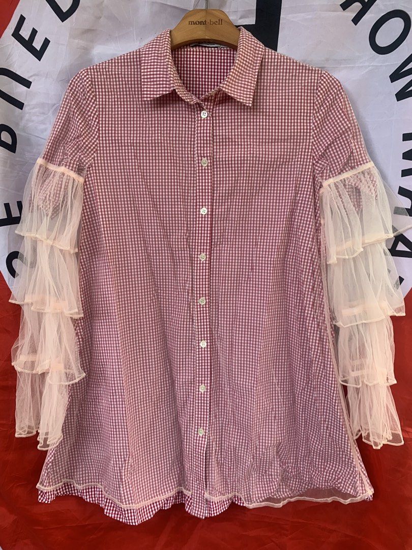 T by Alexander Wang Red/Pink Gingham Tulle Ruffle Polo Button Down (Category: Blouses) located in Angeles City. Submitted by kj772c_ (Listing ID 1468741419, Image 1). Description: - Brand: T by Alexander Wang - Size: S (tag attached) - Color/Pattern: Red and white gingham - Material: Lightweight fabric with sheer tulle ruffles - Features: Collared neck, front button closure, layered tulle ruffle long sleeves - Style: Unique statement piece blendi