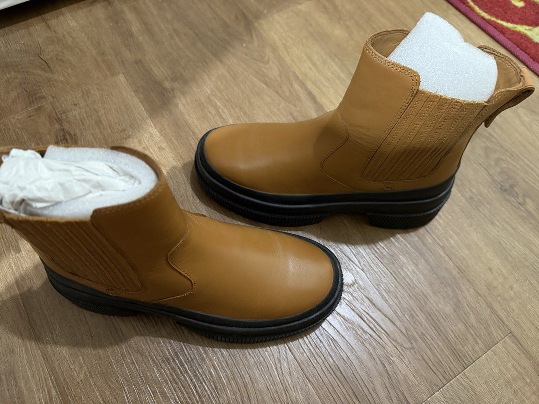 Tan Chelsea Boots Chunky Black Sole (Category: Boots) located in Pasig City. Submitted by swiftwhale.3e81de (Listing ID 1468914910, Image 3). Description: - Color: Tan - Style: Slip-on Chelsea boots with elastic side panels - Sole: Chunky black rubber lug sole - Features: Convenient heel pull tabs - Condition: Used once, still stuffed with protective paper inserts, no box - Size 5 - RFS: Bought new boots - Original bought at Official Sperry Store
