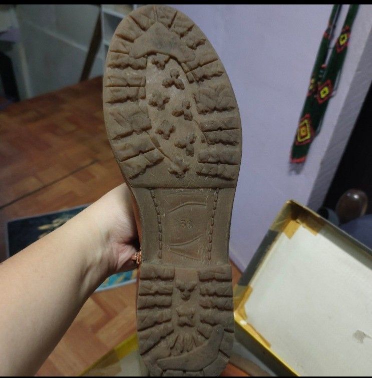 Tan leather ankle boots size 38 (Category: Boots) located in Quezon City. Submitted by dncpreloved (Listing ID 1468807638, Image 2). Description: - Style: Tan leather ankle boots with side zippers - Size: 38 (marked on sole) - Heel & Sole: Low block heel and rugged rubber outsole - Condition: Some discoloration and spotting on the leather surface.