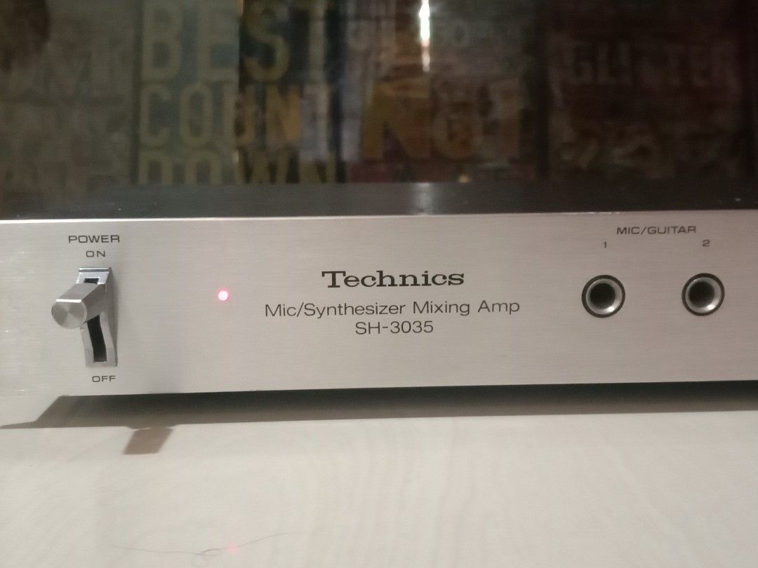 Technics SH-3035 Mic/Synthesizer Mixing Amp 110v (Category: Musical Instruments) located in Manila. Submitted by redvincent01640 (Listing ID 1468890363, Image 2). Description: Technics SH-3035 microphone and synthesizer mixing amplifier. Runs on 110v power. Includes front panel inputs for mics or guitars, mic echo control, mic mixing knob, tape monitor controls, and synthesizer/auxiliary input. Rear panel includes RCA jacks and AC outlet. Silver 