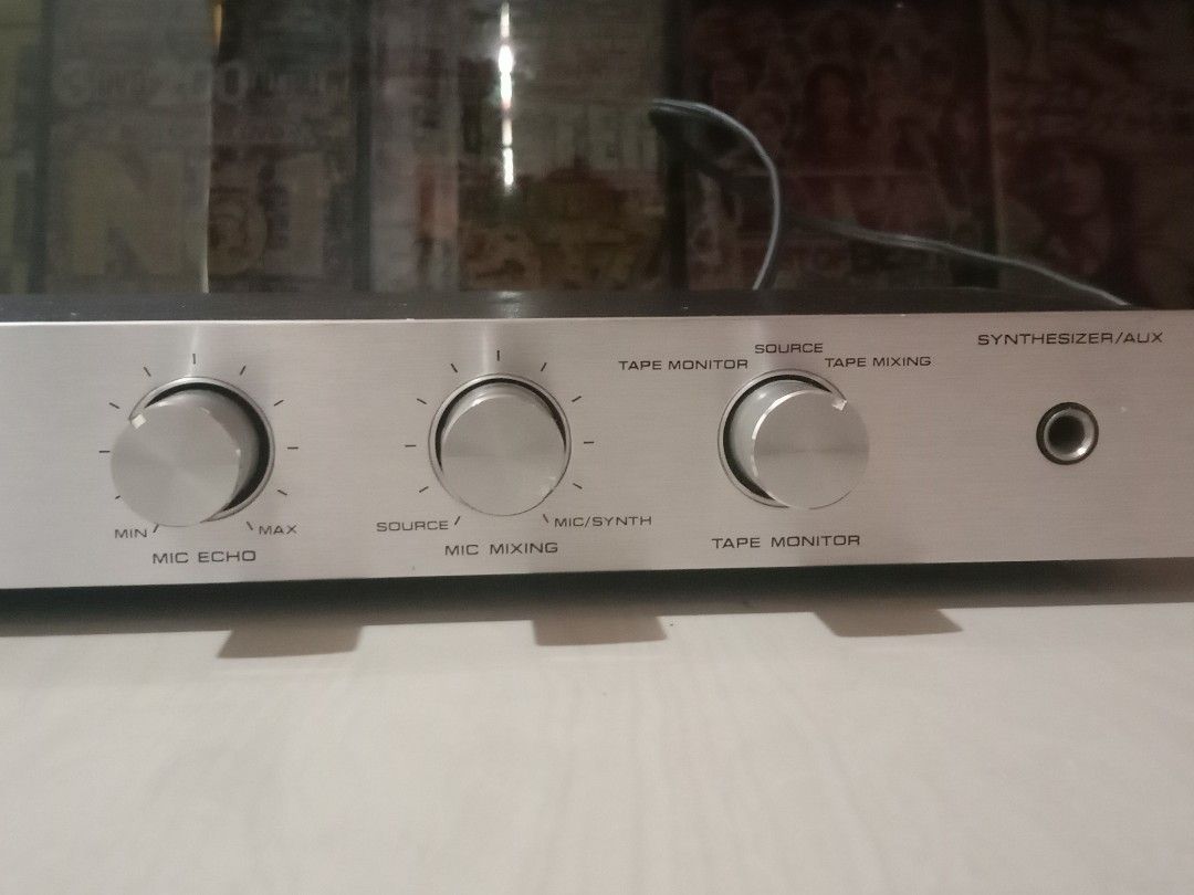 Technics SH-3035 Mic/Synthesizer Mixing Amp 110v (Category: Musical Instruments) located in Manila. Submitted by redvincent01640 (Listing ID 1468890363, Image 3). Description: Technics SH-3035 microphone and synthesizer mixing amplifier. Runs on 110v power. Includes front panel inputs for mics or guitars, mic echo control, mic mixing knob, tape monitor controls, and synthesizer/auxiliary input. Rear panel includes RCA jacks and AC outlet. Silver 