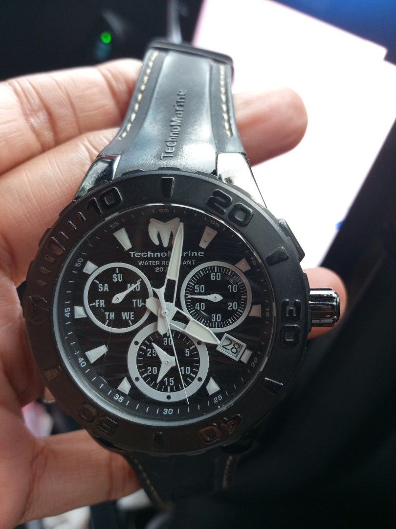 TechnoMarine Chronograph Watch Black Silicone Strap (Category: Men's Watches) located in Malolos. Submitted by lizarondoe59660 (Listing ID 1468741899, Image 3). Description: - Brand: TechnoMarine - Type: Chronograph watch - Dial: Black textured dial with 3 sub-dials and date window at 4 o'clock - Bezel: Black rotating bezel with numeric markers - Case: Stainless steel - Strap: Branded black silicone strap with contrast stitching and distinct logo