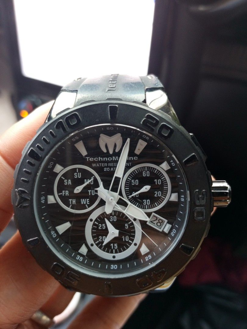 TechnoMarine Chronograph Watch Black Silicone Strap (Category: Men's Watches) located in Malolos. Submitted by lizarondoe59660 (Listing ID 1468741899, Image 1). Description: - Brand: TechnoMarine - Type: Chronograph watch - Dial: Black textured dial with 3 sub-dials and date window at 4 o'clock - Bezel: Black rotating bezel with numeric markers - Case: Stainless steel - Strap: Branded black silicone strap with contrast stitching and distinct logo