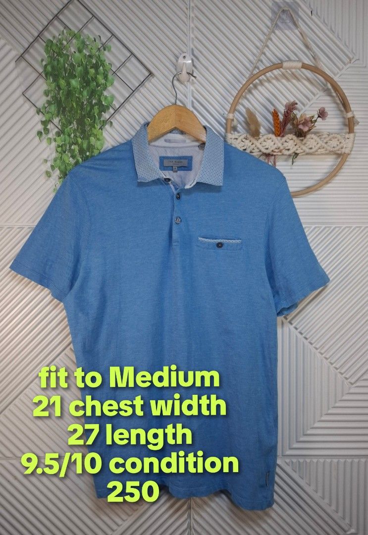 Ted Baker Blue Polo Shirt Medium (Category: Tshirts & Polo Shirts ) located in Bulacan. Submitted by cathycampo51092 (Listing ID 1468725987, Image 2). Description: Ted Baker blue polo shirt. Patterned collar and pocket trim. Chest width measures 21 inches, length is 27 inches. Fits like a Medium. Button placket at the front. Short sleeves. Clean fabric, well maintained..