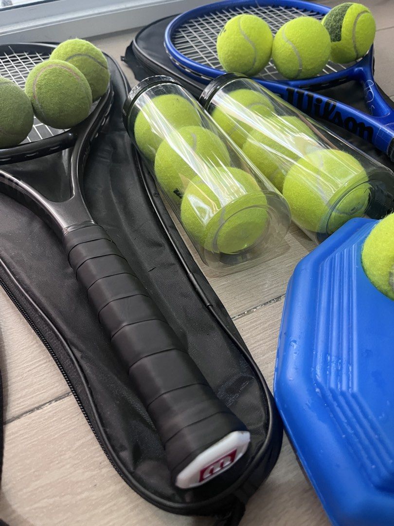 Tennis Set: 2 Rackets, Balls, Trainer (Category: Racket and Ball Sports) located in Taguig. Submitted by graceeeee. (Listing ID 1468732365, Image 3). Description: - Tennis Rackets (Black & Blue) with carrying cases - Tennis balls - Blue solo tennis trainer rebounder base with string and ball attachment for solo practice -Bought from Laz for 1,600+ Php -No issues. Lightly used; some balls used but mostly new RFS: moving out Loc: next to Venice Mal