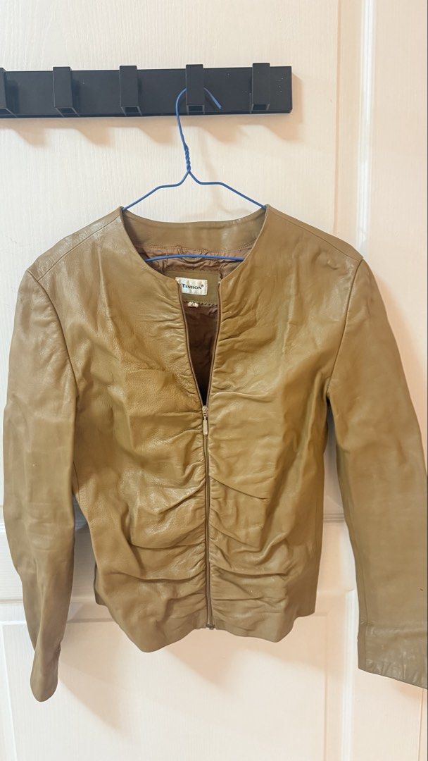 Tension leather jacket tan brown zip up size 42 (Category: Coats, Jackets and Outerwear) located in Makati City. Submitted by jianciee (Listing ID 1468723688, Image 3). Description: - Brand: Tension - Size: 42 (tag on collar) - Color: Tan brown - Material: Soft leather with lined interior - Closure: Full front zipper - Design: Unique gathered ruching on both sides of the zipper - Fit: Short cropped cut with smooth long sleeves.