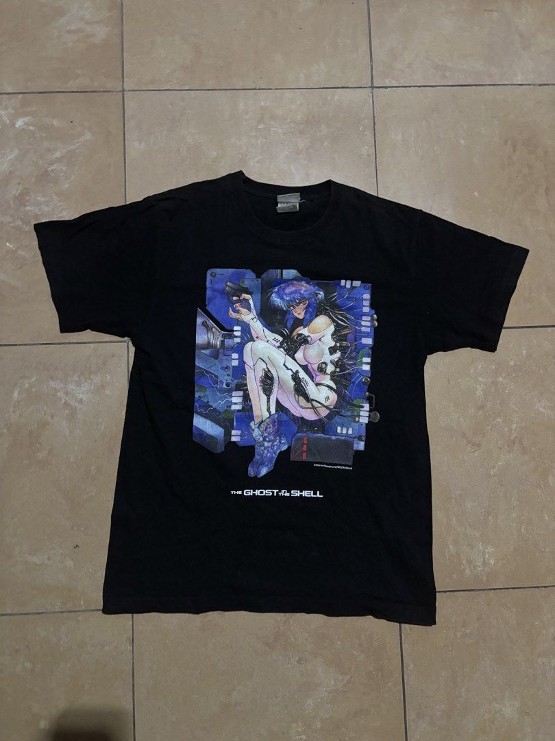 The Ghost in the Shell Anime T-Shirt (Category: Tshirts & Polo Shirts ) located in Las Pinas. Submitted by nateb. (Listing ID 1468849877, Image 1). Description: - Design: Iconic Ghost in the Shell anime graphic with Motoko Kusanagi on the front - Material: 100% premium cotton - Size: Medium (Pit-to-pit: ~18.5 inches, Length: ~26 inches) - Details: Purchased at the Masamune Shirow Exhibit last year - Condition: Clean fabric with minor, normal wear