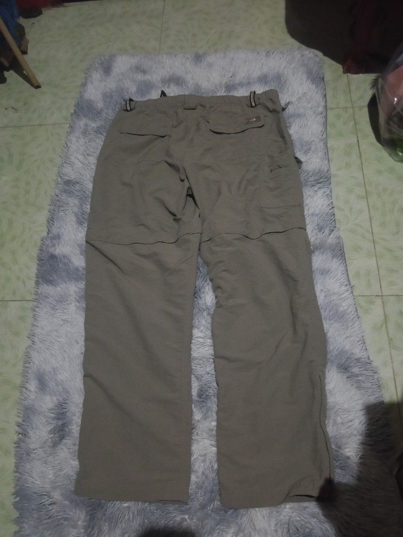 The North Face Convertible Cargo Pants (Category: Trousers) located in Lingayen. Submitted by rahzzelula73279 (Listing ID 1468725547, Image 2). Description: - Brand: The North Face - Item: Convertible Cargo Pants - Color: Khaki Grey - Size: XL - Zip-off legs instantly transform pants into shorts - Built-in adjustable black web belt included - Multiple functional cargo pockets on legs and back - Embroidered logo detail - Lightweight, durable nylon
