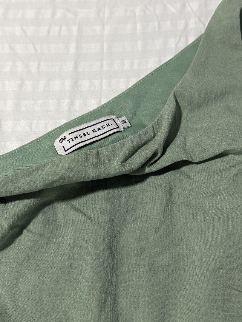 The Tinsel Rack sage green one shoulder top (Category: Sleeveless) located in Caloocan City. Submitted by ncldumps (Listing ID 1468881632, Image 2). Description: - Bought it from Singapore - Linen fabric can do meetups around ubelt! .
