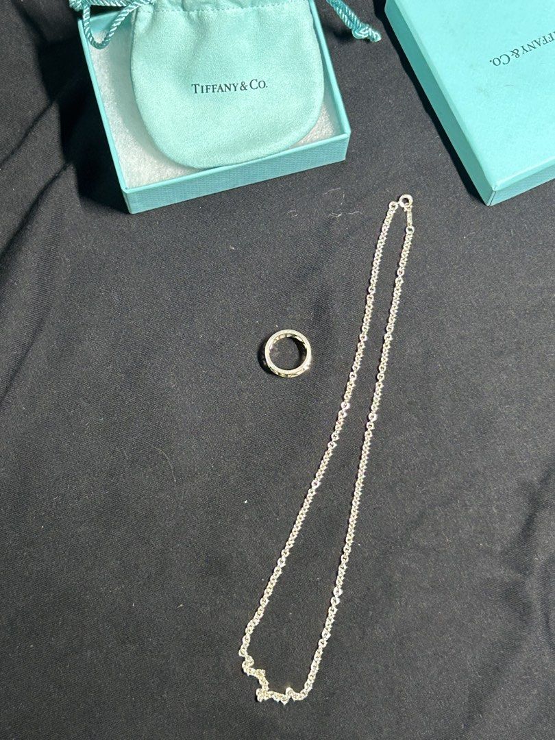 Tiffany & Co. Silver Ring and Chain Necklace (Category: Luxury Accessories) located in Cavite. Submitted by florabells (Listing ID 1468796202, Image 2). Description: - Brand: Auth. Tiffany & Co. - Material: Authentic sterling silver - Set Includes: atlas ring and link chain necklace - Packaging: Signature Tiffany blue gift box with original textured cotton padding - Condition: Excellent, classic silver polish -ring size: 54 - chain size : 18 inch