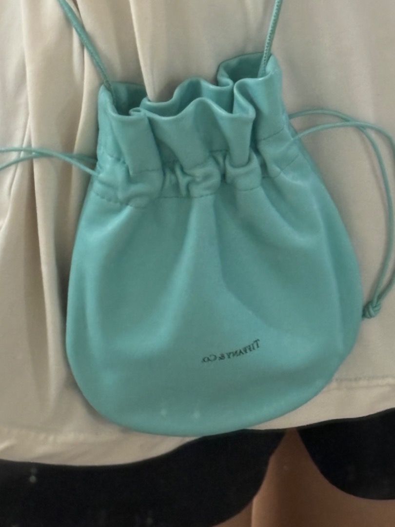 Tiffany & Co. Turquoise Leather Drawstring Bucket Bag (Category: Shoulder Bags) located in Makati City. Submitted by bravelion-b2bc (Listing ID 1468912199, Image 2). Description: - Brand: Tiffany & Co. - Material: lamb skin - Color: Signature Tiffany Blue - Style: Bucket bag (Crossbody or shoulder wear) - Closure: Drawstring - Interior: Matching leather lining with slip pockets - Origin: Made in Italy - Condition: Clean shape with minimal wear .