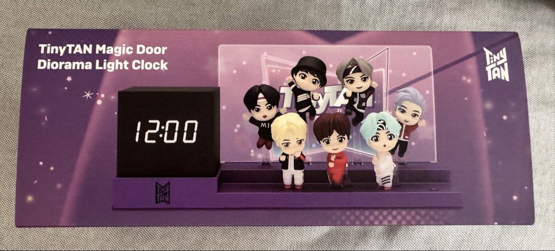 TinyTAN light clock (Category: K-Wave Merchandise) located in Singapore. Submitted by labbitpj (Listing ID 1468732959, Image 1). Description: - Official BTS TinyTAN Magic Door Diorama Light Clock - Includes main clock unit, diorama stand, and miniature character figures - Features members in MIC Drop and iconic outfits - Comes securely stored in original foam packaging - Perfect collectible for your desk or shelf display.