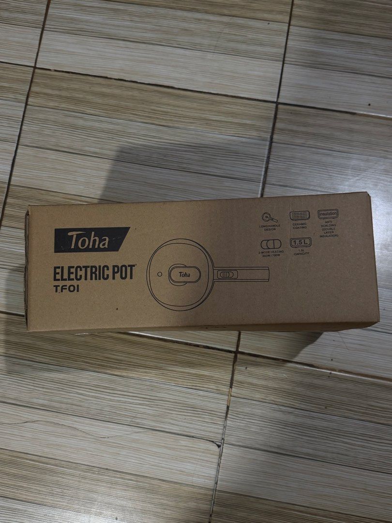 Toha TF01 Electric Pot 1.5L Multi-Function Cooking Pot (Category: Cookware & Accessories) located in Mandaluyong City. Submitted by isydln (Listing ID 1468800240, Image 3). Description: Brand: Toha Electric Pot (Model TF01) - Color: Elegant White - Capacity: 1.5L with safe ceramic coating - Design: Long handle with anti-scalding double-layer insulation - Power Modes: Two-level heating (350W for simmering, 700W for fast cooking) - Inclusions: Comp