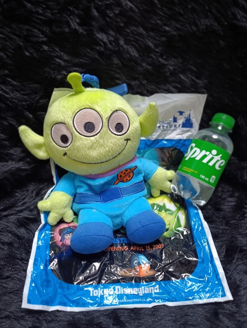 Tokyo Disney Resort Alien Plush Toy (Category: Plushies & Soft Toys) located in Iloilo. Submitted by jpk_ok_sales (Listing ID 1468804676, Image 1). Description: - Authentic Tokyo Disney Resort merchandise - Toy Story Green Alien in iconic blue spacesuit - Features a handy back zipper pouch with yellow zipper pull and a strap - Includes original Tokyo Disney Disneyland packaging bag - Brand new with tag attached - Perfect for daily use or collecti