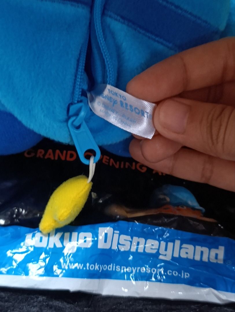 Tokyo Disney Resort Alien Plush Toy (Category: Plushies & Soft Toys) located in Iloilo. Submitted by jpk_ok_sales (Listing ID 1468804676, Image 2). Description: - Authentic Tokyo Disney Resort merchandise - Toy Story Green Alien in iconic blue spacesuit - Features a handy back zipper pouch with yellow zipper pull and a strap - Includes original Tokyo Disney Disneyland packaging bag - Brand new with tag attached - Perfect for daily use or collecti