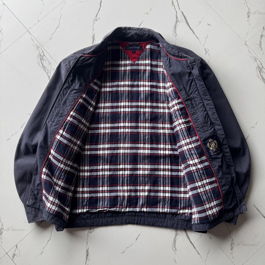Tommy Hilfiger Flannel Lined Navy Harrington Jacket (Category: Coats, Jackets and Outerwear) located in Baguio. Submitted by retrophiletown (Listing ID 1468898395, Image 3). Description: Tommy Hilfiger Flannel Lined Navy Harrington Jacket Measurement in inches Width: 25 Length: 27 Issues: minor fade, scratch.