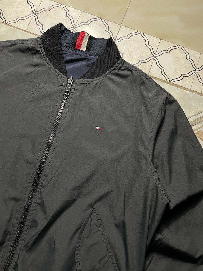 Tommy Hilfiger Reversible bomber jacket (Category: Coats, Jackets and Outerwear) located in Quezon City. Submitted by renovare.196 (Listing ID 1468903077, Image 3). Description: Tommy Hilfiger Reversible bomber jacket As New Condition Color Rate: 9.8/10 Issue Not Working Last pic Measurements • Width: 22 • Length: 25.5 Price: 2000 obo DM IF INTERESTED📥.