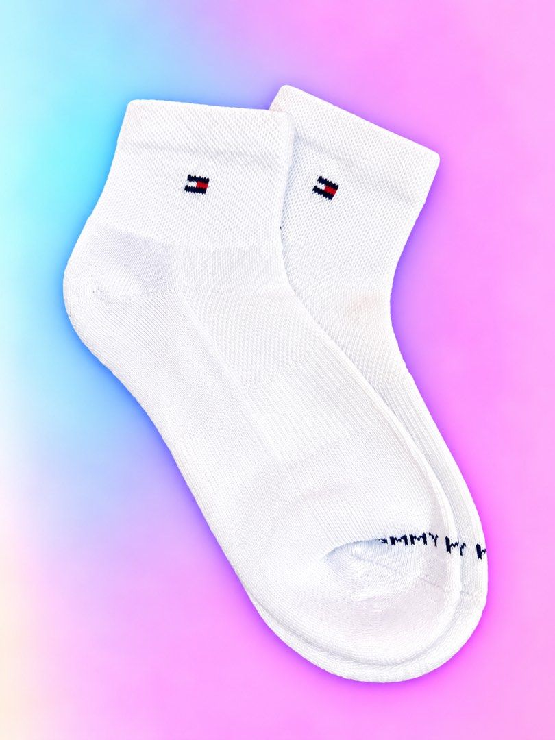 Tommy Hilfiger White Ankle Socks (Category: Socks & Tights) located in Quezon City. Submitted by turtleandfishes (Listing ID 1468737232, Image 1). Description: - Brand: Tommy Hilfiger - Style: Ankle socks - Color: Clean white - Features: Small logo embroidery near cuff, ribbed texture for stretch and comfort, and Tommy lettering printed across the toe.