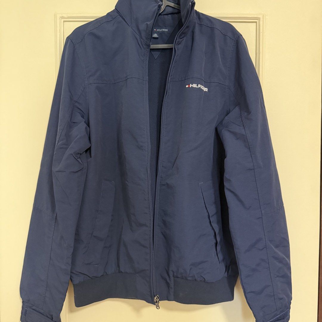 Tommy Hilfiger Yacht Jacket (Category: Coats, Jackets and Outerwear) located in Manila. Submitted by usetheoxfordcomma (Listing ID 1468825141, Image 1). Description: Windbreaker Size XS but fits small Some lint buildup on the interior side of the elastic waist band (probably removable) Has a packable hood No other issues Shipping only via same-day delivery services.
