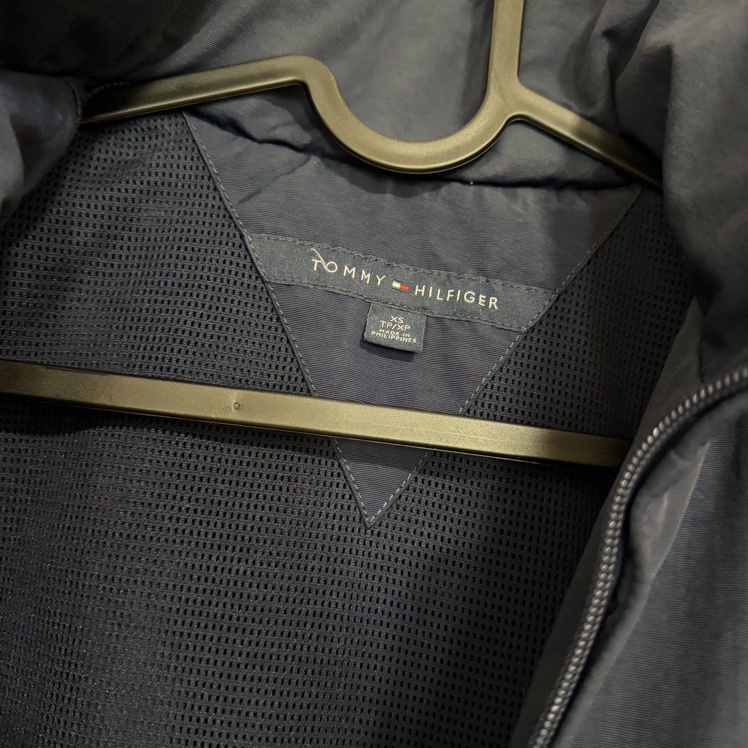 Tommy Hilfiger Yacht Jacket (Category: Coats, Jackets and Outerwear) located in Manila. Submitted by usetheoxfordcomma (Listing ID 1468825141, Image 3). Description: Windbreaker Size XS but fits small Some lint buildup on the interior side of the elastic waist band (probably removable) Has a packable hood No other issues Shipping only via same-day delivery services.