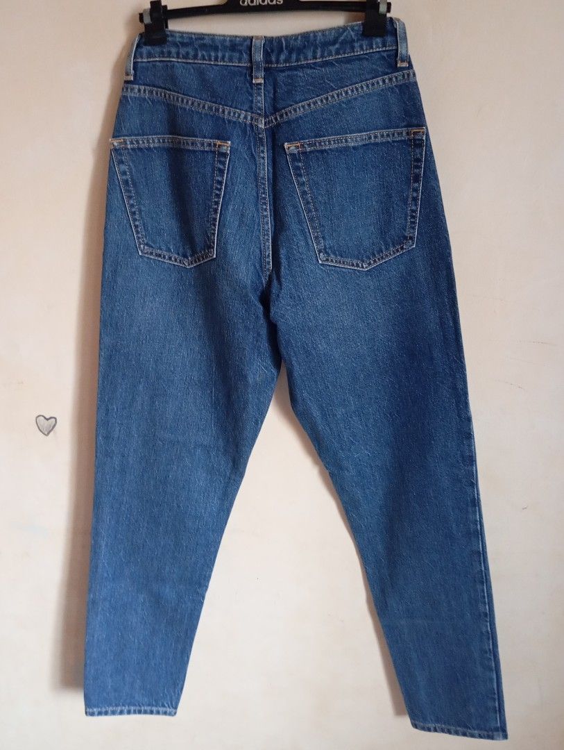 Topshop Blue Denim Jeans (Category: Jeans) located in Cabanatuan. Submitted by w3ng.gay (Listing ID 1468751349, Image 3). Description: - Brand: Topshop - Style: High waist, straight leg - Wash: Medium blue with contrast stitching - Details: 5-pocket setup, button and zip fly closure - Condition: Excellent everyday wardrobe staple, easy to style.