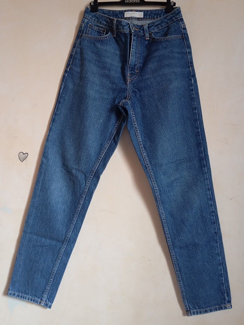 Topshop Blue Denim Jeans (Category: Jeans) located in Cabanatuan. Submitted by w3ng.gay (Listing ID 1468751349, Image 1). Description: - Brand: Topshop - Style: High waist, straight leg - Wash: Medium blue with contrast stitching - Details: 5-pocket setup, button and zip fly closure - Condition: Excellent everyday wardrobe staple, easy to style.
