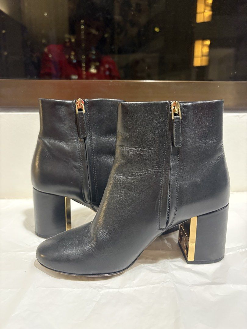 Tory Burch boots 6.5M (Category: Boots) located in Taguig. Submitted by loise001_of_rewear (Listing ID 1468814668, Image 2). Description: Tory Burch low, block-heeled boots. Subtle gold Tory Burch logo detailing on the inner heel. About 2.5in block heel height. Inner side zips. 6.5M, fits EU 37 No returns or exchanges. Please feel free to ask for more details on the item. .