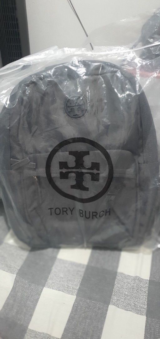 Tory Burch Nylon Backpack Multiple Colors Available (Category: Backpacks) located in Paranaque City. Submitted by personal_preloved40 (Listing ID 1468924740, Image 3). Description: - 100% Brand new with tags and original packaging plastic - Stylish colorblock design in navy, grey, and olive green - Lightweight nylon material perfect for daily use - Spacious main compartment for your everyday essentials - Front zippered pocket featuring the signat