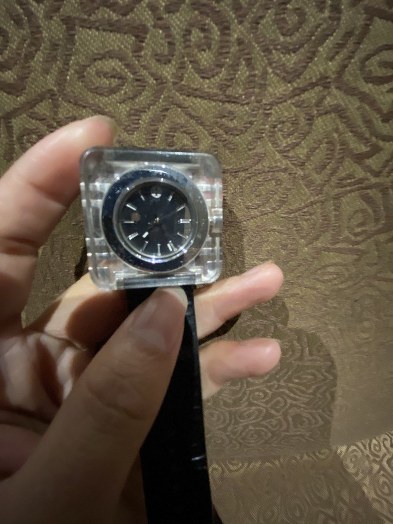 Tory Burch Square Izzie Square Lucite (Category: Women's Watches) located in Quezon City. Submitted by mjgaudier (Listing ID 1468866048, Image 3). Description: - Brand: Tory Burch - Design: Geometric square clear crystal casing with a round black dial - Strap: Genuine black leather with buckle closure and engraved logo hardware - Movement: Swiss made, battery-operated quartz - Inclusions: Original orange Tory Burch presentation box and packaging 