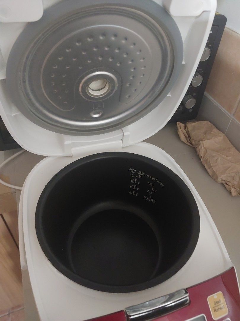 TOSOT IH Rice Cooker Red (Category: Cookers) located in Manila. Submitted by cheweyboy_ph (Listing ID 1468794216, Image 2). Description: - Brand/Model: TOSOT IH Rice Cooker - Color: Rich Red - Controls: Top digital control panel - Cooking Modes: Porridge, soup, steam, and more - Inner Pot: Includes clear measurement markings for short rice, long rice, and porridge - Condition: Clean interior and lid mechanism, great for everyday use.