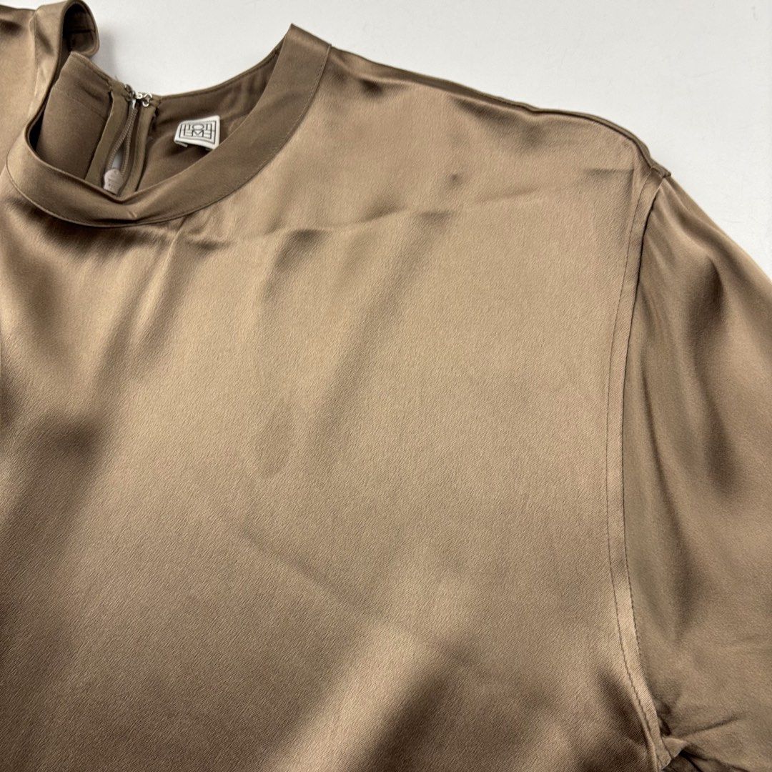 Toteme Silk Shirt (Category: Shirts) located in Makati City. Submitted by ragrepository (Listing ID 1468736961, Image 2). Description: Toteme Silk Shirt Tagged as 36 Length- 27” Pit to pit- 22” Sleeves- 10.5” Shoulder-19” Condition-9/10 Flaw- Watermarks ( steam iron) .