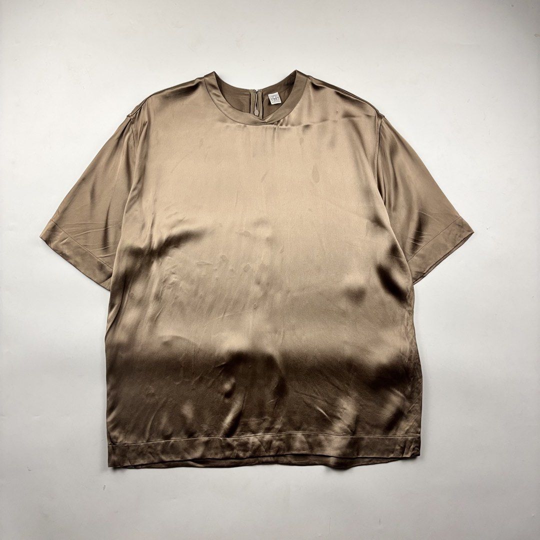 Toteme Silk Shirt (Category: Shirts) located in Makati City. Submitted by ragrepository (Listing ID 1468736961, Image 1). Description: Toteme Silk Shirt Tagged as 36 Length- 27” Pit to pit- 22” Sleeves- 10.5” Shoulder-19” Condition-9/10 Flaw- Watermarks ( steam iron) .