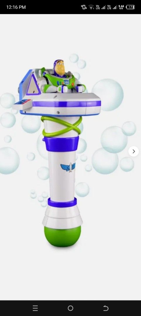 Toy Story Buzz Lightyear Bubble Blower Wand (Category: Action & Battle Toys) located in Manila. Submitted by iccythng0216 (Listing ID 1468741917, Image 1). Description: Buzz Lightyear bubble blower toy. White body with purple and green details. Features a bubble wand nozzle on the front with three red and yellow circular ports behind it. Action figure of Buzz Lightyear seated on top of the blaster unit. Handle has a purple power switch on the sid