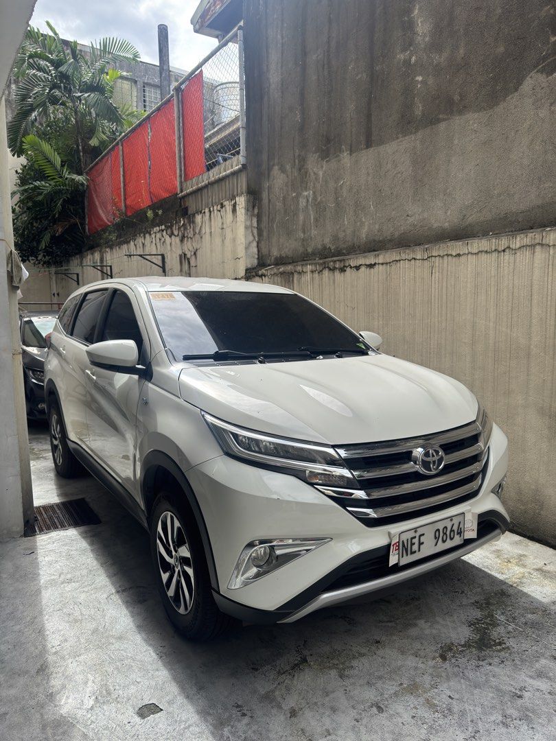 Toyota Rush 1.5 X (A) (Category: Used Cars) located in Quezon City. Submitted by nikolodejesus (Listing ID 1468814319, Image 1). Description: FOR SALE: 2021 TOYOTA RUSH E AT – VEHICLE DETAILS * Make & Model: Toyota Rush E * Year Model: 2021 * Transmission: Automatic * Color: White * Odometer Reading: 41,592 km * Fuel Type: Gasoline * Body Type: SUV * Plate Number: NEF 9864 ✅ Spacious and comfortable interior ✅ Stylish white exterior ✅ Perfect for