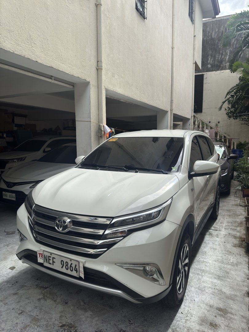 Toyota Rush 1.5 X (A) (Category: Used Cars) located in Quezon City. Submitted by nikolodejesus (Listing ID 1468814319, Image 2). Description: FOR SALE: 2021 TOYOTA RUSH E AT – VEHICLE DETAILS * Make & Model: Toyota Rush E * Year Model: 2021 * Transmission: Automatic * Color: White * Odometer Reading: 41,592 km * Fuel Type: Gasoline * Body Type: SUV * Plate Number: NEF 9864 ✅ Spacious and comfortable interior ✅ Stylish white exterior ✅ Perfect for
