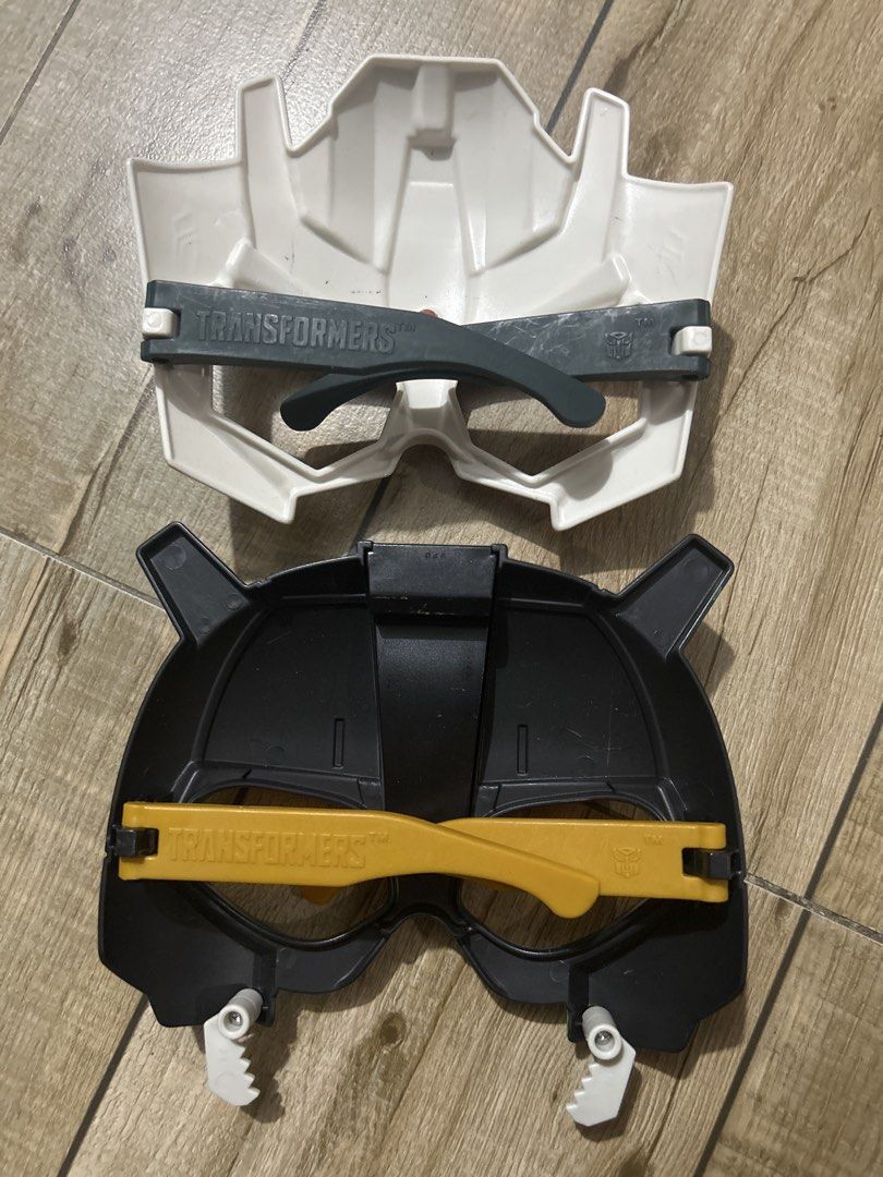 Hasbro Transformers Kids Mask Set (Category: Character Goods) located in Paranaque City. Submitted by zac.sei (Listing ID 1468810323, Image 2). Description: for 3-5 yrs old - Set of 2 official McDonald's Transformers character masks from 2016 - Includes one white/yellow mask and one black/yellow mask featuring the iconic Autobot logo - Wearable novelty toy glasses style with temples on the back for comfortable wear - Stamped with Hasbro and McDon