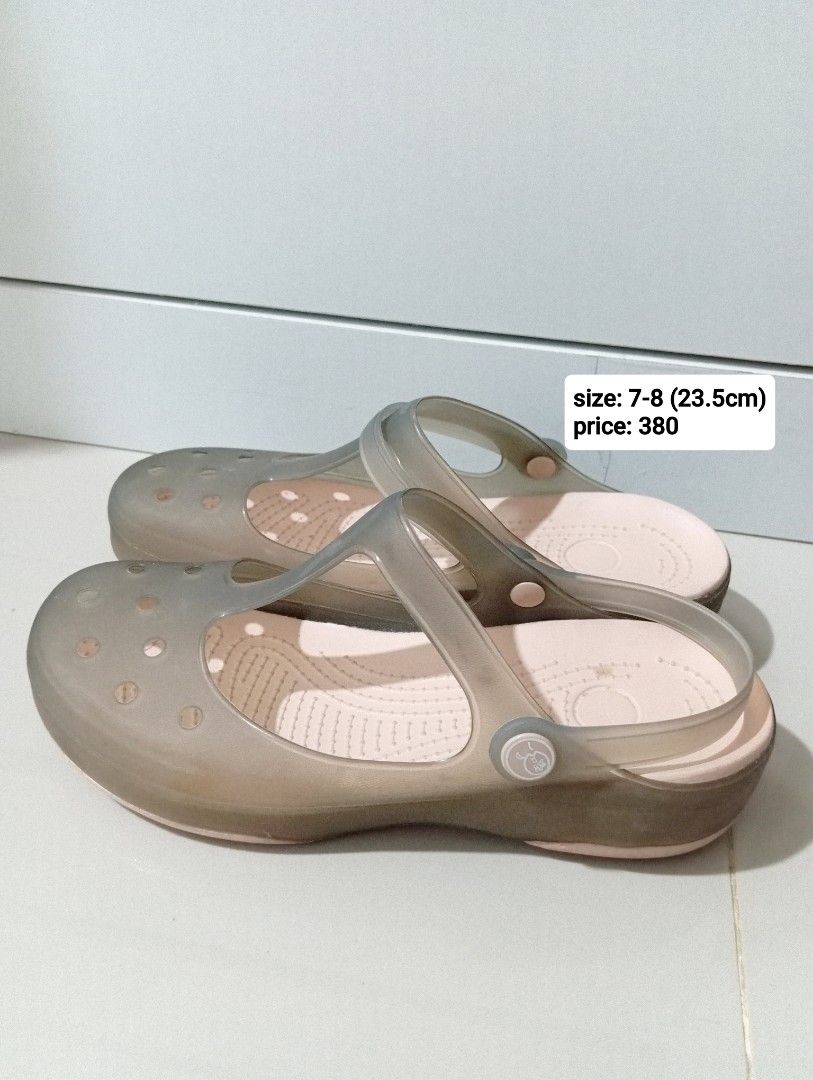 Translucent Jelly Clog Sandals Size 7-8 23.5cm (Category: Sandals) located in Manila. Submitted by cococlo_ (Listing ID 1468733090, Image 1). Description: - Translucent grey jelly clogs with a cute pink inner sole - Size: 7-8 (measures 23.5cm) - Slip-on style featuring ventilation holes and side strap detail - Comfortable molded footbed with a light platform heel - Great and stylish everyday casual footwear option.