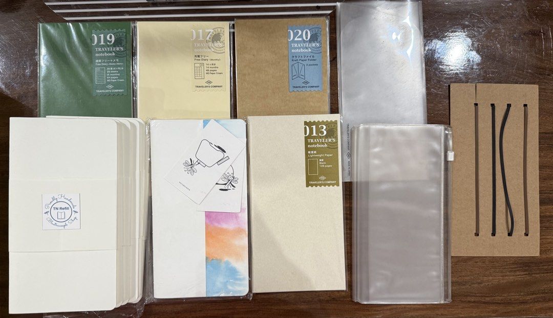 Traveler’s Notebook Refills & Accessories Set (Category: Other Stationery & Craft) located in Manila. Submitted by tater_thoughts (Listing ID 1468776190, Image 1). Description: Sold as Set 013 Lightweight Paper 017 Free Diary (Monthly) 019 Free Diary (Weekly + Memo) 008 Zipper Case (Used) 029 Three-fold File(used) (6) Bluetraces Ph TN Standard Refills 020 Kraft Folder Connecting Bands(free) Bluetraces Ph Monthly Planner MOP: BDO or BPI RFS: downs