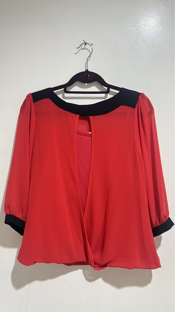 Trends Red and Black Blouse Size L (Category: Blouses) located in Cabuyao City. Submitted by calmstorm.0108 (Listing ID 1468837073, Image 1). Description: - Brand: Trends - Size: L - Color: Red with stylish black colorblock details on collar and cuffs - Sleeves: Three-quarter sleeves - Design: Draped, open-back with an attached red inner layer - Material: Lightweight, soft, and very comfortable - Versatility: Perfect for casual days or office wea