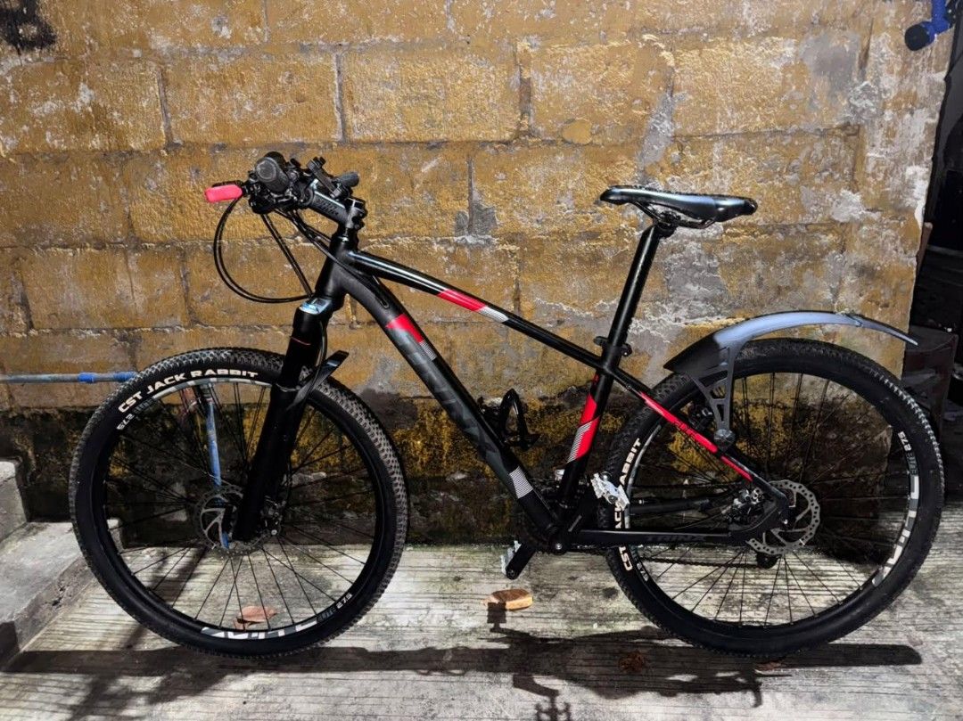 Trinx 27.5 Mountain Bike Black Red (Category: Bicycles) located in Manila. Submitted by aamh__ (Listing ID 1468916316, Image 2). Description: Shimano altus groupset. rockbros bottle holder air lock fork with remote shimano hydraulic brakes cst jack rabbit makapal pa zefal fender rockbros bicycle lock litepro pedals gagamitin nalang may bawas pa sa sure buyer check all you want test all you want kargado parts chat lang po..