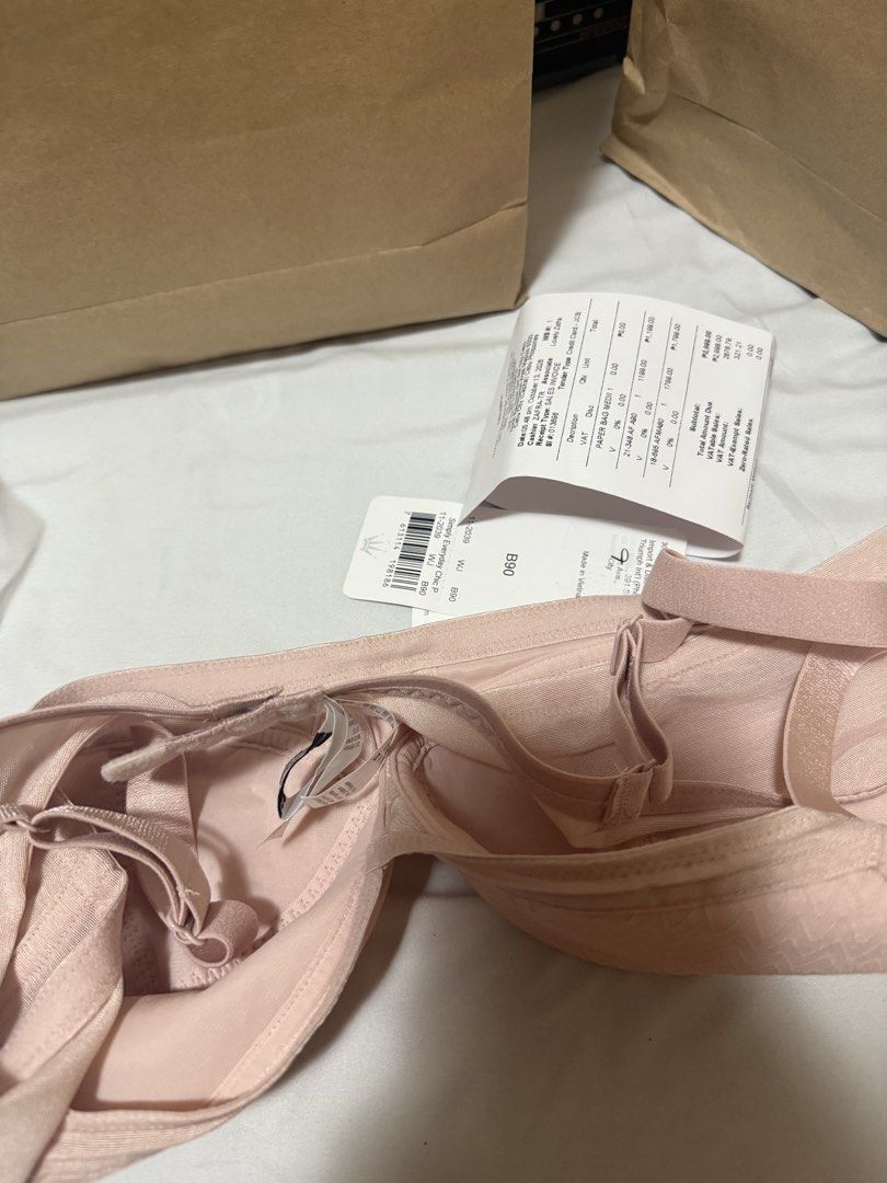 Triumph Simply Everyday Chic P Bra B90 (Category: Undergarments & Loungewear) located in Cebu City. Submitted by jocapin32 (Listing ID 1468733182, Image 2). Description: - Brand: Triumph (Simply Everyday Chic P) - Size: B90/CupB40 - Color: Pink - Condition: Brand new, never worn with original store tag attached - Features: Zigzag pattern texture, underwire support, and adjustable straps - Inclusions: Original store tag -d kasya kay mama.
