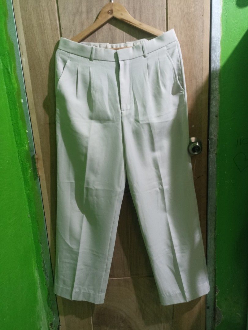 Trouser Michel Andre Off-White Pleated Trousers Size 34 (Category: Trousers) located in Tarlac. Submitted by allinoneshop2178 (Listing ID 1468738607, Image 1). Description: - Brand: Michel Andre - Color: Off-white / Neutral - Size: 34 -length:42inch - Fit: Straight wide-leg cut with double pleats on the front - Pockets: Two welt pockets on the back - Details: Clean finish along the waistband and cuffs - Versatility: Easy to style with any button-