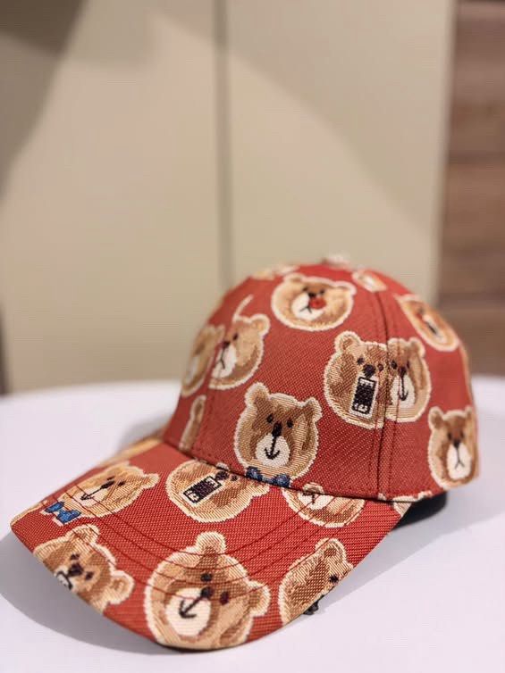 TTWN Bear Orange Teddy Bear Print Baseball Cap (Category: Vintage Collectibles) located in Cebu City. Submitted by ubecstoned (Listing ID 1468819215, Image 2). Description: - Brand: TTWN Bear - Color: Vibrant orange with all-over woven teddy bear pattern (includes bears in blue bowties) - Material: 100% cotton with black inner lining and branded tag - Fit: Adjustable metal strap closure at the back.