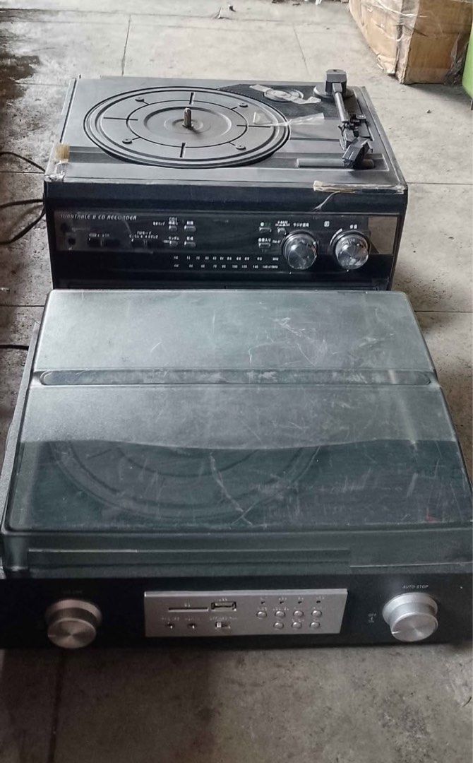 Turntable and CD Recorder Audio System (Category: Portable Music Players) located in Caloocan City. Submitted by BrixGarcia (Listing ID 1468791469, Image 1). Description: - 2-in-1 audio units: Turntable and CD recorder with built-in radio tuners - Classic design: Features front panel dials, volume knobs, and playback/recording buttons - Unit 1 details: Includes an open CD tray below the receiver - Unit 2 details: Comes with a protective dust cove