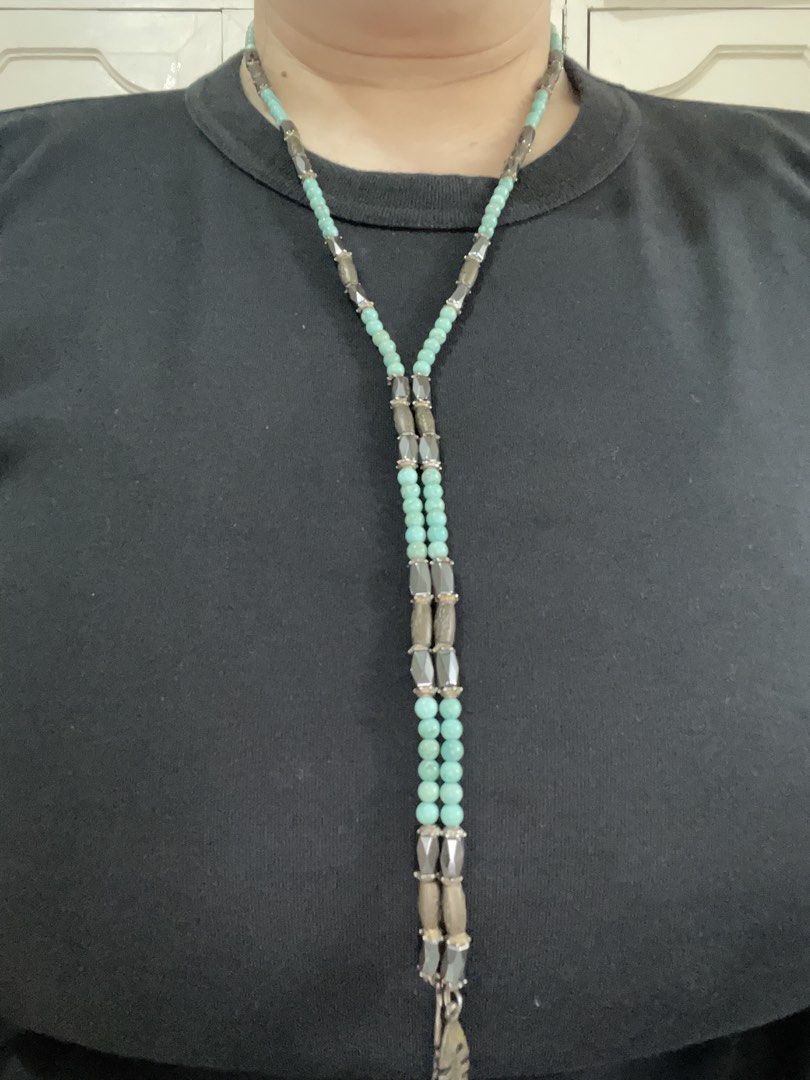 Turquoise Beaded Necklace with Fish Bone Charms (Category: Necklaces) located in San Juan City. Submitted by redrosierose (Listing ID 1468713544, Image 3). Description: - Dual-strand design: Can be worn as a choker or layered look - Materials: Turquoise round beads, metallic faceted beads, and grey cylinder beads - Distinctive details: Finished with playful dangling fish skeleton charms - Style: Boho aesthetic with earthy tones - Perfect for addi