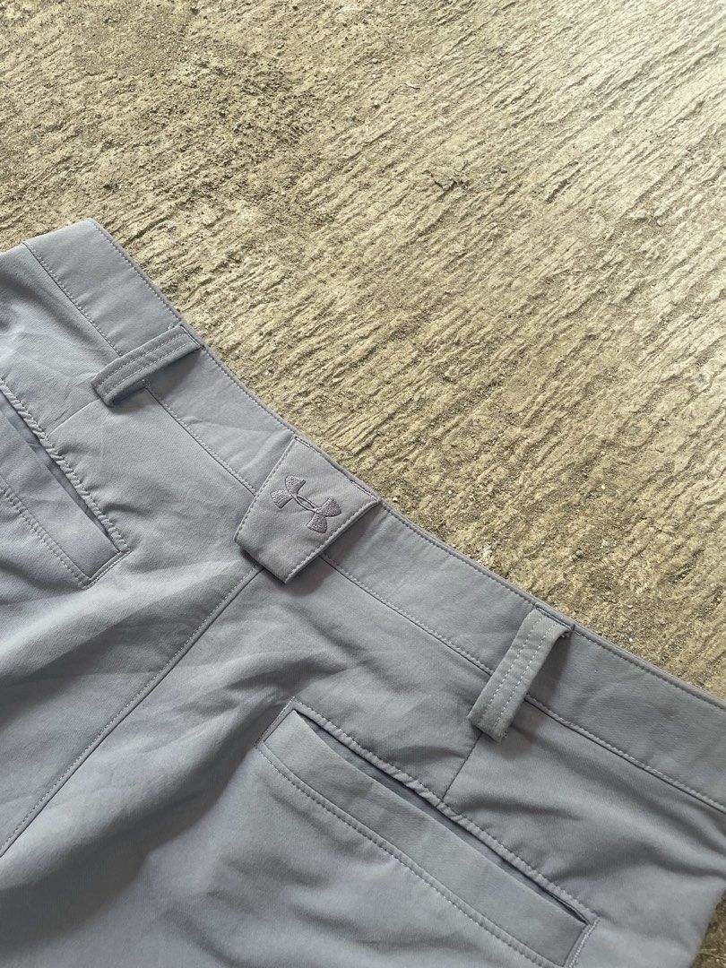 Under Armour Grey Golf Shorts Size 34 (Category: Shorts) located in Manila. Submitted by lawlaw21 (Listing ID 1468801588, Image 3). Description: - Brand: Under Armour - Size: 34 waist - Color: Grey - Material: Lightweight and breathable, ideal for golf or hot weather - Pockets: Two front pockets and two back welt pockets with button closure - Features: Stretch waistband with logo tag detail on back loop - Condition: Clean, hardly worn.