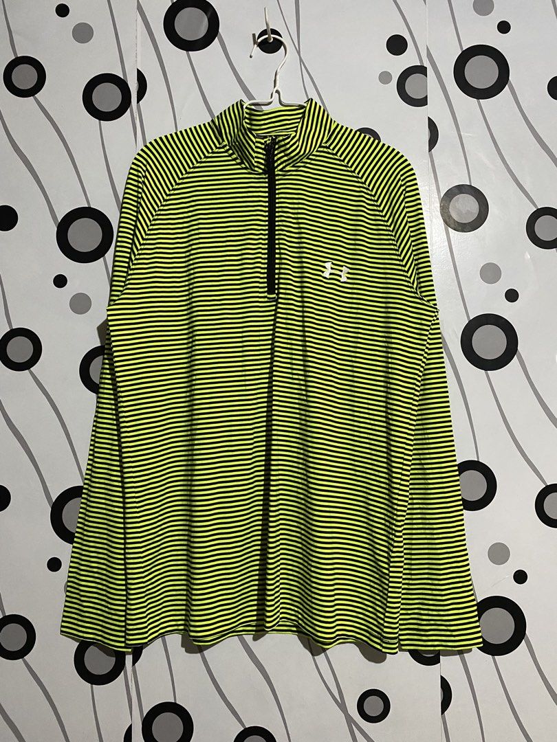 Under Armour long-sleeve, quarter-zip athletic top (Category: Activewear) located in Cebu City. Submitted by patspickph (Listing ID 1468787324, Image 1). Description: This is a neon yellow and dark/gray micro-striped Under Armour long-sleeve, quarter-zip athletic top with a mock neck and moisture-wicking HeatGear-style fabric. Size XXL on tag dimensions W22 L29.5. Good As New No issue Excellent Condition👍👌.